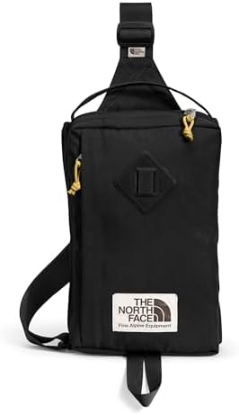 The North Face Berkeley Field Bag | Water Repellent Finish, Vintage Style Travel Essential, Sling Holds Water Bottles, Phones & Keys, TNF Black/Mineral Gold-NPF, One Size